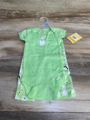 Top-down view of green Hello Bello 2-piece bodysuit and pants with bunny chest applique and snap crotch on wood background