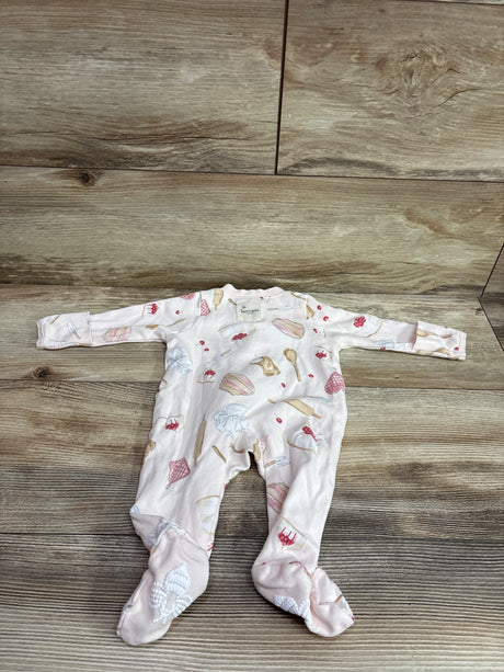 Me n Mommy To Be pink organic newborn sleeper with dessert prints on a wooden background