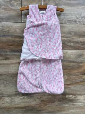 Pink and white infant swaddle sleep sack with bunny pattern on wooden background