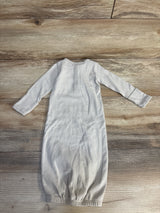 Gray and white striped baby sleep sack on wooden floor