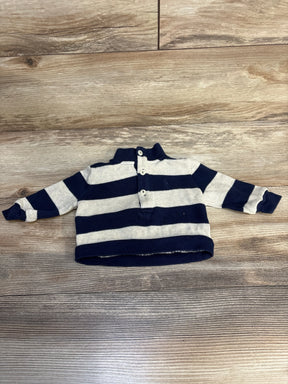 Navy and gray striped toddler pullover sweater with buttons, long sleeves, laid on wood floor