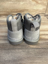 Gray toddler suede boots with fleece lining, side zippers, and textured soles on wood floor