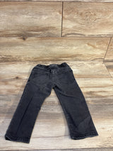 Back view of Baby Gap grey denim toddler jeans showing elastic drawstring waistband and back pockets on wood background