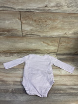 Back view of Carter’s Auntie’s Little Bean bodysuit showcasing purple and white stripes and long sleeves on a wood floor