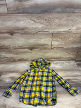 Yellow and blue plaid hooded button-up flannel shirt for kids on wood background