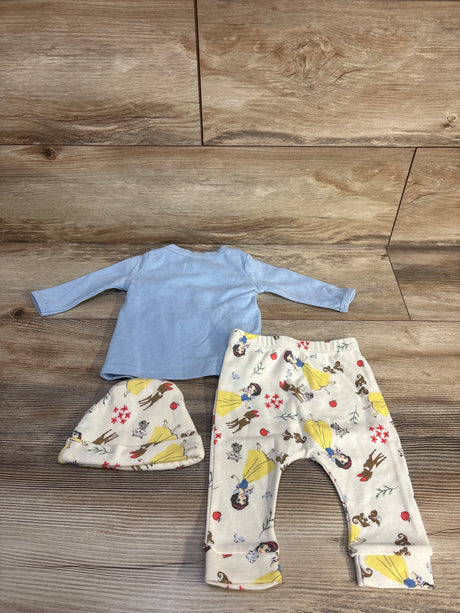 Top view of Disney Baby 3-piece set showing light blue shirt and cream Snow White print pants and hat on wood floor