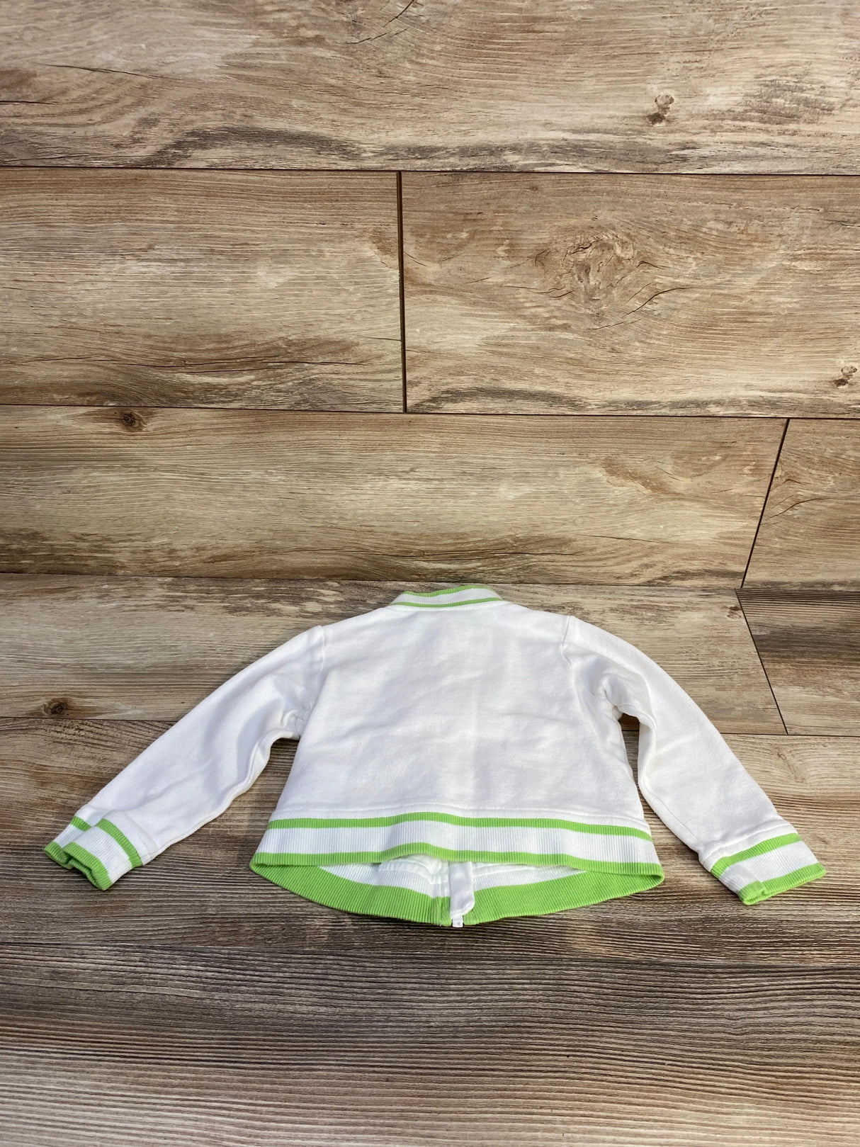 Front view of Janie and Jack white Mickey Mouse ruffle tennis jacket with ruffle trim and front zipper, size 2T