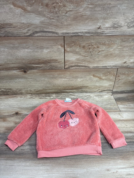 Pekkle plush red cherry sweatshirt for toddlers, size 24m, on a wood background