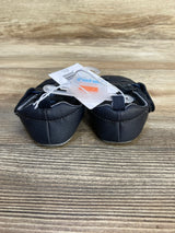 Navy blue baby shoes with tags on wood background, children's footwear resale item