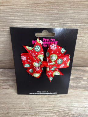 Red holiday bow with snowflake print for kids, festive Christmas hair accessory on black card