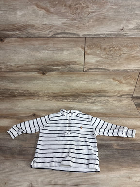 Children's white long sleeve shirt with navy stripes and front zipper, laid on wooden floor