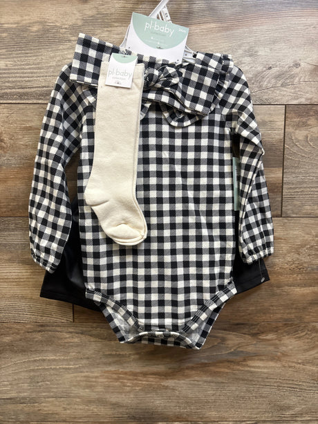 Top-down view of a PL Baby four-piece layette set showcasing a black-and-white gingham bodysuit and cream sock on wood