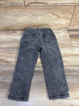 Back view of grey toddler jeans size 2T showing elastic waistband and back pockets laid flat on wood surface