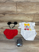 Baby birthday outfit with white onesie, red bloomers, black polka dot suspenders, and mouse ear headband