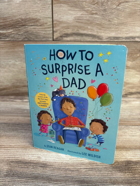 Front cover of How to Surprise a Dad board book showing dad in armchair with two children and balloons on wood background