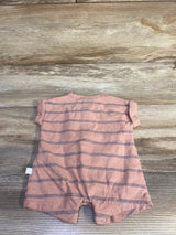 Back view of Little Planet organic striped shortie romper in muted orange showing navy horizontal stripes and snap crotch on wood background