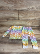Children's long sleeve pajama set with rainbow colors and white butterfly patterns on wooden floor