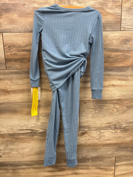 Back view of Cloud Island 2-piece blue pointelle snug-fit toddler pajama set showing ribbed texture and side knot on wood background