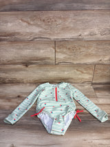 Front view of green girls' long-sleeve rash guard with white stripes and small strawberry print on white background