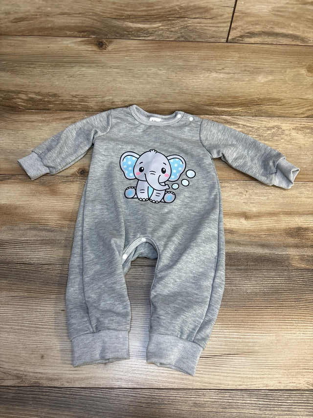Gray baby romper with cute cartoon elephant print on wooden floor