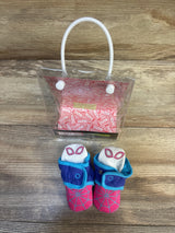 Marvel Spider-Girl baby booties with snap closure, 0-3 months, in original packaging on wood floor