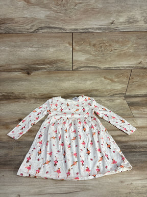 White long-sleeve toddler dress with pink and orange ballerina print on wooden floor background