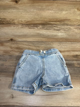 Front of Cat and Jack blue denim drawstring shorts with elastic waist, front pockets and rolled cuffs on wood background