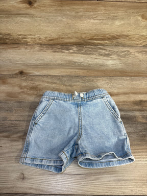Front of Cat and Jack blue denim drawstring shorts with elastic waist, front pockets and rolled cuffs on wood background