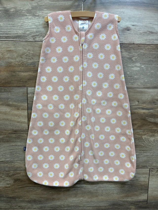 Front view of pink Halo SleepSack blanket for 6 to 12 months showcasing daisy print and front zipper on a wooden background