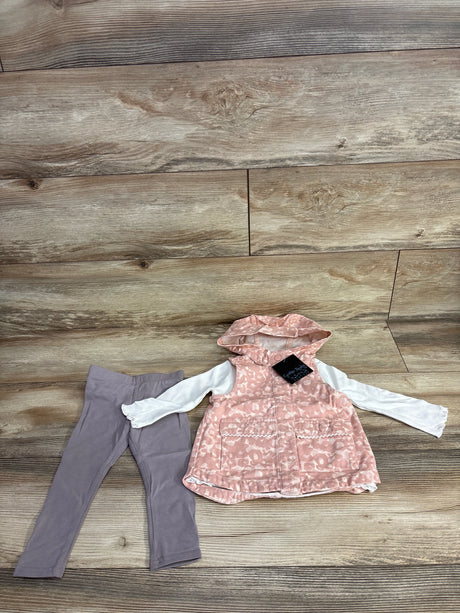 Toddler outfit with pink leopard print hooded vest and long sleeve white shirt paired with gray leggings on wood floor