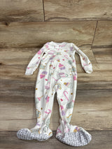 Front view of white Just One You blanket sleeper with pastel candy and cupcake print, zipper, and footed legs on wood flooring