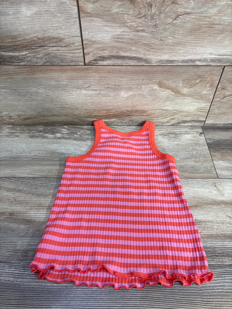Flat lay of Cat & Jack girls' ribbed striped tank top in pink and orange with lettuce-hem ruffle on wood background