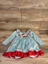 Front flat lay of girls cowgirl boot long sleeve dress size 3T showcasing turquoise gingham pattern, embroidered boot applique and red ruffle hem on wood floor