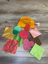 Plush taco toy set with soft fabric play food pieces for kids on wooden background