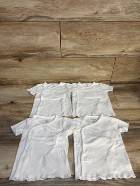 Set of four white baby kimono shirts on wood background, gently used kids clothes