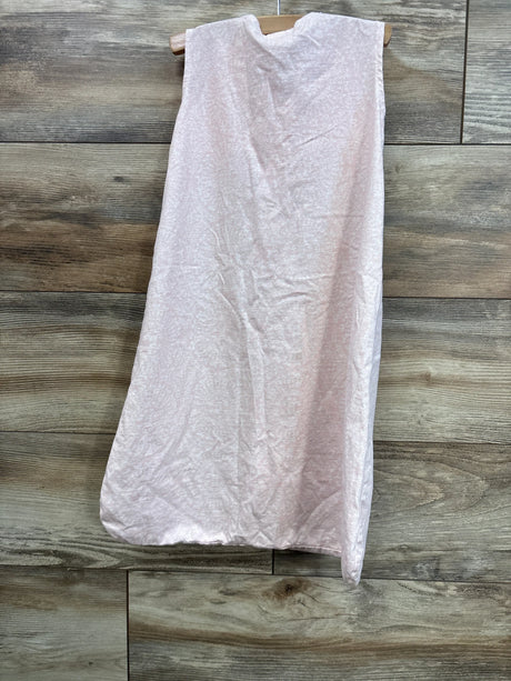 Front view of Yoga Sprout sleep sack in light pink, size 0–6M, sleeveless with roomy bottom, hanging on a wood plank background