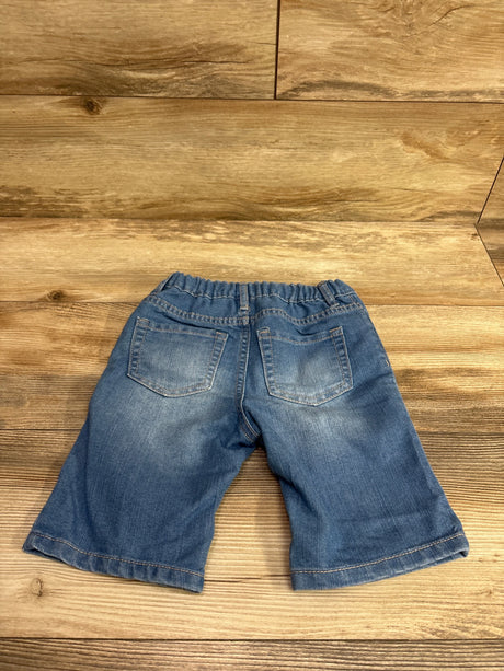Rear view of Children’s Place denim midi mi-long shorts with elastic waistband and back pockets on wood flooring