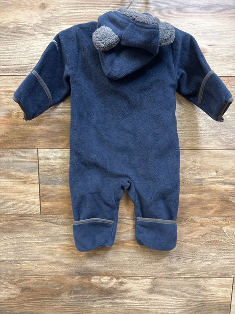 Back view of Columbia Tiny Bear II Bunting in navy, size 3-6 months, showcasing bear-ear hood and gray trim on a wood floor
