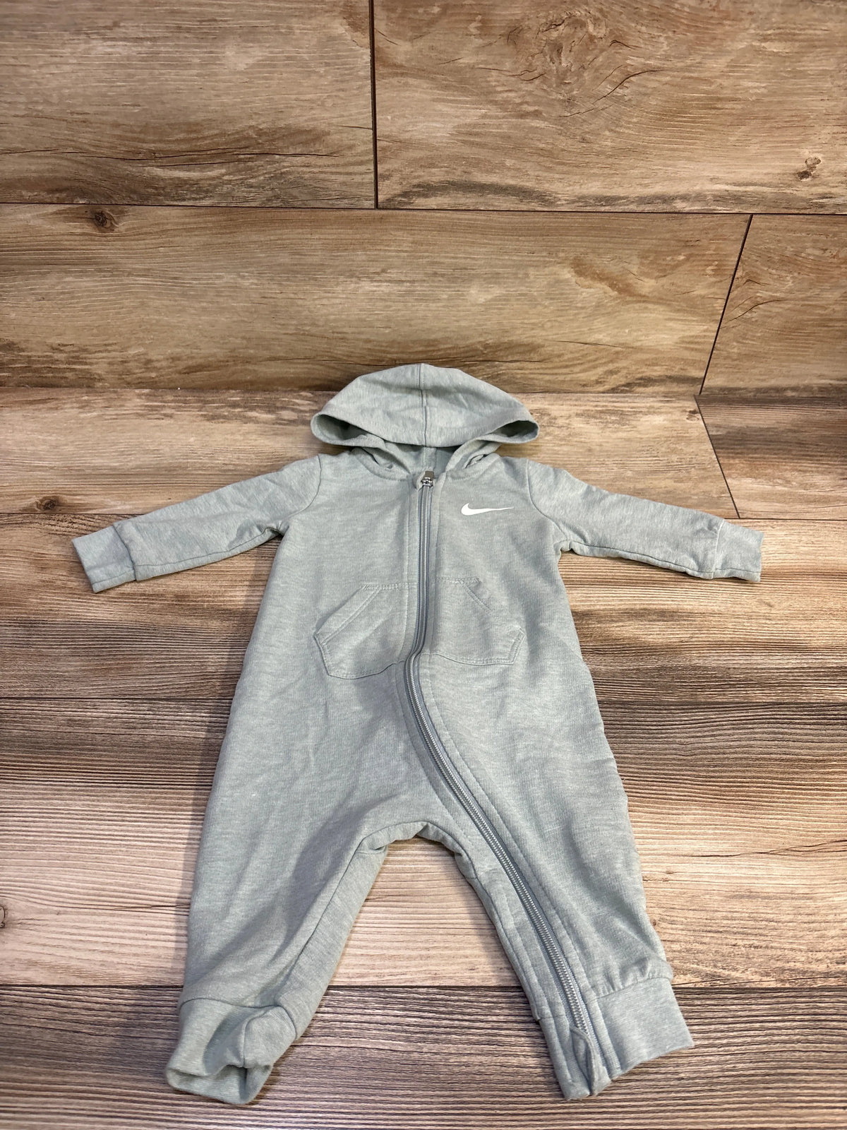 Sage green Nike hooded baby coverall with front zipper and logo on chest