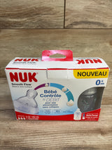 Front of NUK 3-pack 5 oz baby bottles in safari elephant print in original box showing SafeTemp indicator on wooden surface