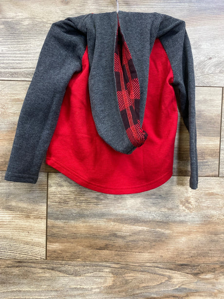Red and gray long sleeve kids shirt with buffalo plaid detail on wooden background