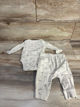Flat lay of Cloud Island 2-piece beige ribbed bodysuit and pants with grey animal print on wood background