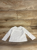 Back view of Oshkosh white long-sleeve toddler shirt (4T) showcasing scalloped collar and keyhole button closure, laid flat on wood floor