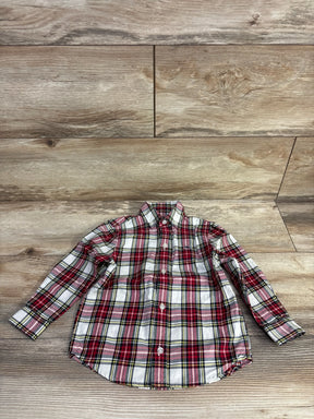 Red plaid long sleeve button-up shirt on wood floor