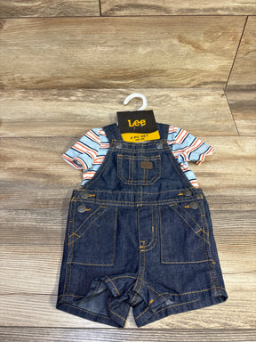 Front flat lay of Lee newborn denim shortall with striped light blue tee showing front chest pocket and contrast stitching on wood background