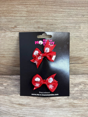 Red Santa snowflake hair bows for kids, festive holiday accessories on black card