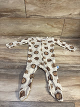 Front view of Millie & Myles tan sleeper, size 3-6m with long sleeves, front zipper, and lion and bear print on wood floor