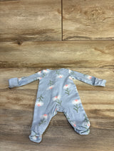 Flat lay of newborn footed sleeper (Just One You) showing light blue fabric with white and peach floral print on wooden background