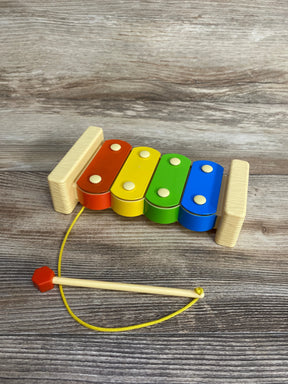 Colorful wooden xylophone toy with mallet for kids on wood background