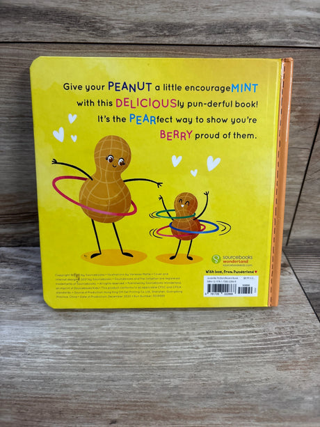 Back of Donut Give Up board book, yellow back cover with peanut characters hula-hooping and punny headline on wood background